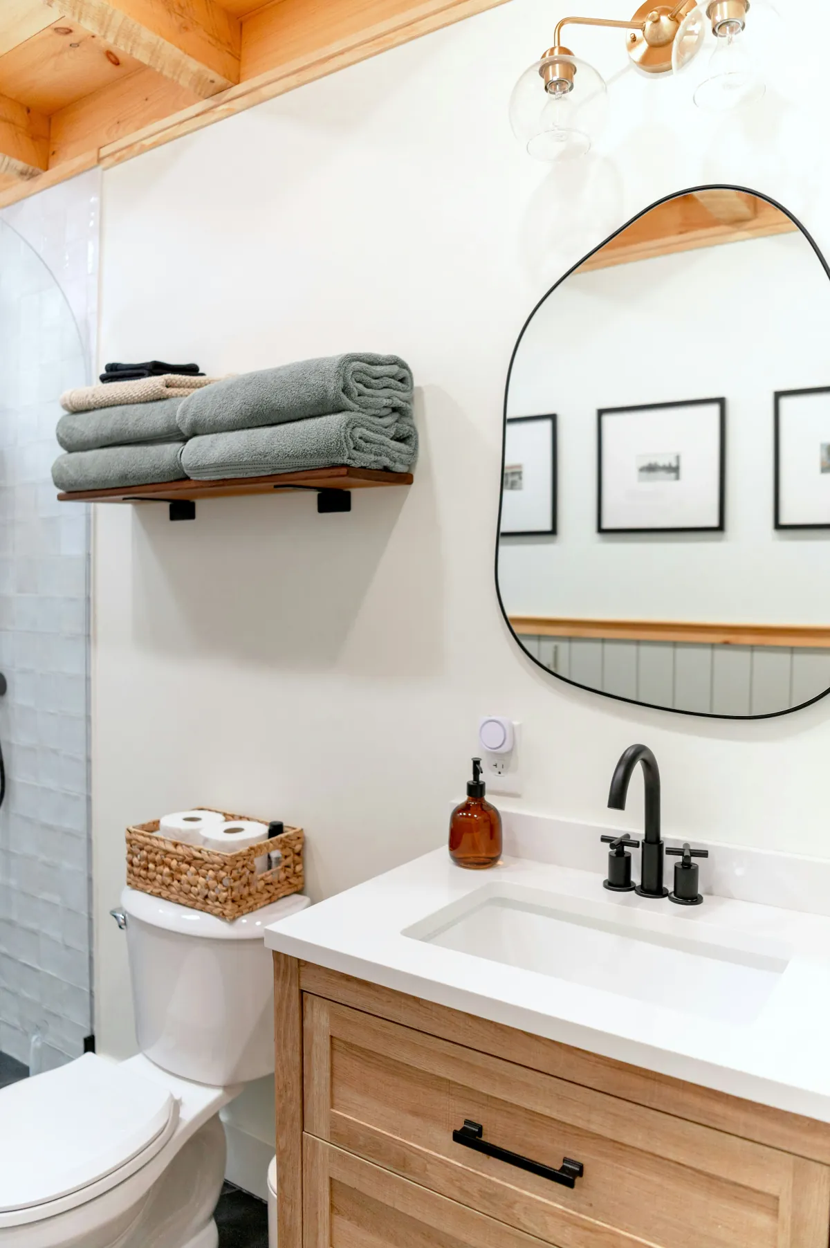 Spotless bathroom sink with neatly folded towels